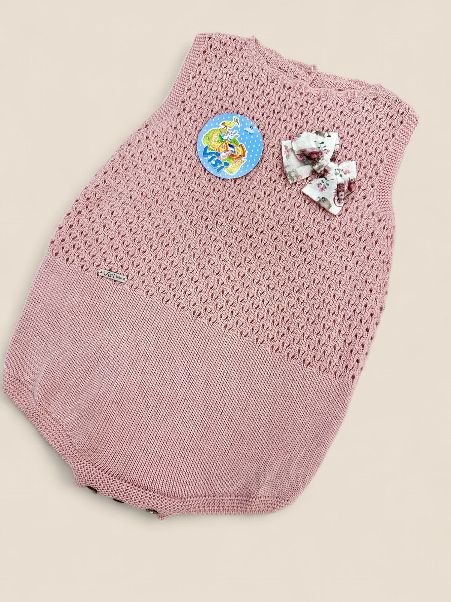 Ranita rosa punto calado con lazo floral.