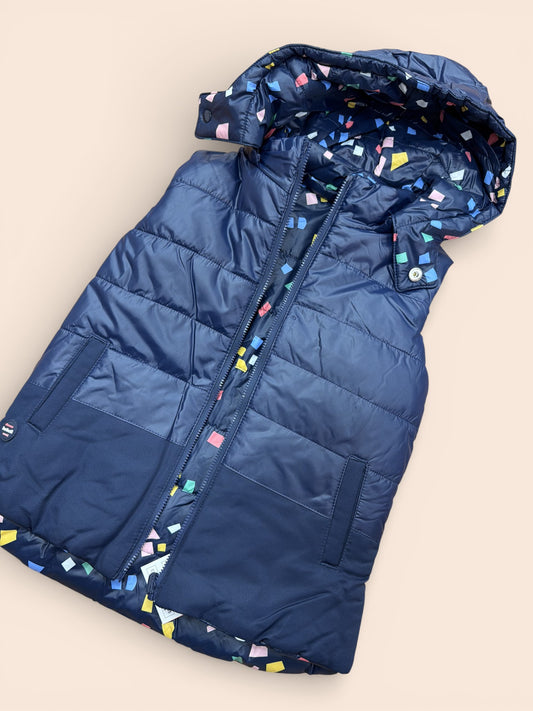 Chaleco reversible acolchado azul marino con capucha y forro estampado infantil