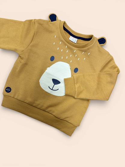 Sudadera infantil color mostaza con carita de oso y orejitas