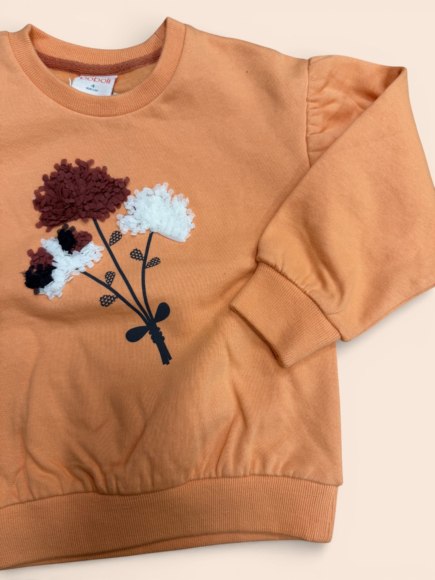 Sudadera infantil color teja con flores en relieve y manga abullonada
