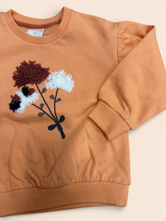 Sudadera infantil color teja con flores en relieve y manga abullonada